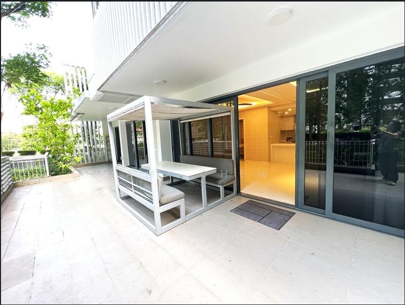 Large private enclosed terrace at Lakefront Residences with a shaded dining cabana